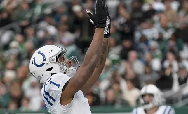 Indianapolis Colts wide receiver Josh Downs (1) reacts after scoring a touchdown against the New York Jets during the fourth quarter of an NFL football game, Sunday, Nov. 17, 2024, in East Rutherford, N.J. (AP Photo/Seth Wenig)