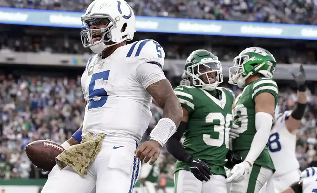 Indianapolis Colts quarterback Anthony Richardson (5) reacts after scoring a touchdown against the New York Jets during the fourth quarter of an NFL football game, Sunday, Nov. 17, 2024, in East Rutherford, N.J. (AP Photo/Adam Hunger)