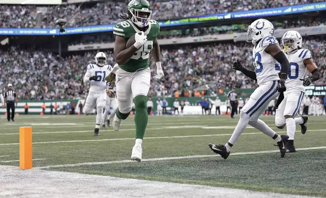 New York Jets tight end Kenny Yeboah (88) crosses the goal line for a touchdown against the Indianapolis Colts during the fourth quarter of an NFL football game, Sunday, Nov. 17, 2024, in East Rutherford, N.J. (AP Photo/Adam Hunger)