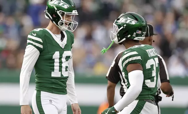 New York Jets place kicker Anders Carlson (18) celebrates with teammates after kicking a 58-yard field goal against the Indianapolis Colts during the third quarter of an NFL football game, Sunday, Nov. 17, 2024, in East Rutherford, N.J. (AP Photo/Adam Hunger)