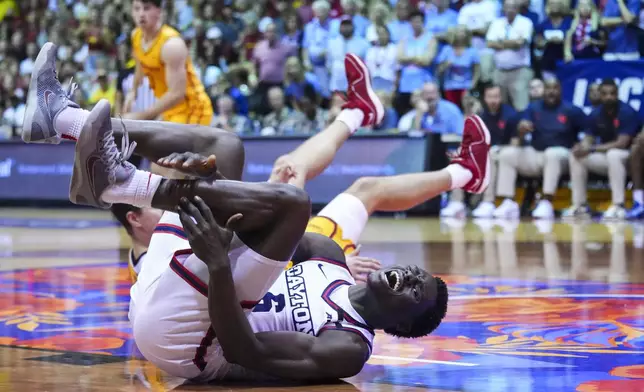 Dayton guard Enoch Cheeks holds his ankle after a collision against Iowa State during the second half of an NCAA college basketball game at the Maui Invitational Tuesday, Nov. 26, 2024, in Lahaina, Hawaii. Iowa State won 89-84. (AP Photo/Lindsey Wasson)