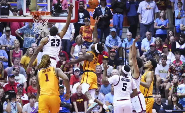 Iowa State guard Keshon Gilbert scores against Dayton forward Zed Key (23) during the second half of an NCAA college basketball game at the Maui Invitational Tuesday, Nov. 26, 2024, in Lahaina, Hawaii. Iowa State won 89-84. (AP Photo/Lindsey Wasson)