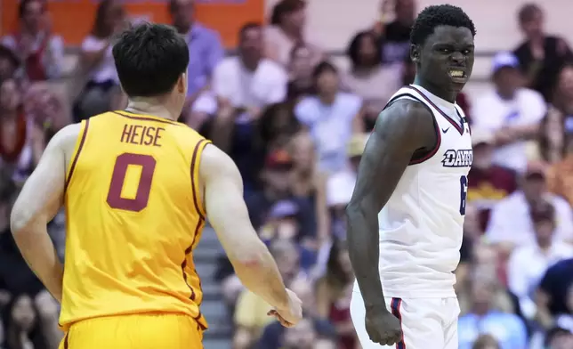 Dayton guard Enoch Cheeks, right, reacts after scoring as Iowa State guard Nate Heise (0) looks on during the second half of an NCAA college basketball game at the Maui Invitational Tuesday, Nov. 26, 2024, in Lahaina, Hawaii. Iowa State won 89-84. (AP Photo/Lindsey Wasson)