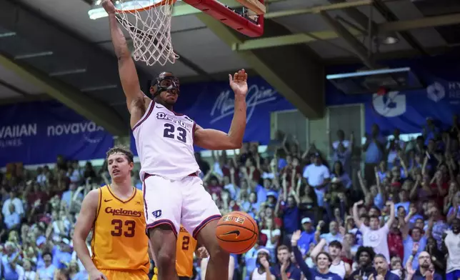 Dayton forward Zed Key (23) dunks against Iowa State forward Brandton Chatfield (33) during the second half of an NCAA college basketball game at the Maui Invitational Tuesday, Nov. 26, 2024, in Lahaina, Hawaii. Iowa State won 89-84. (AP Photo/Lindsey Wasson)