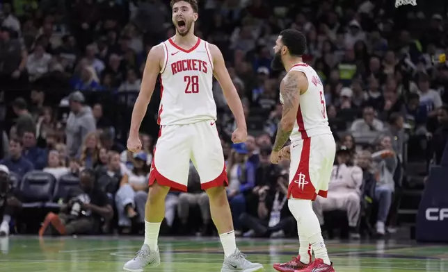 Houston Rockets center Alperen Sengun (28) celebrates next to guard Fred VanVleet (5) after making a shot during overtime of an Emirates NBA cup basketball game against the Minnesota Timberwolves, Tuesday, Nov. 26, 2024, in Minneapolis. (AP Photo/Abbie Parr)