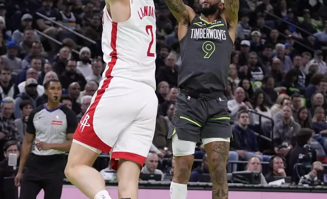 Minnesota Timberwolves guard Nickeil Alexander-Walker (9) shoots over Houston Rockets center Jock Landale (2) during the first half of an Emirates NBA cup basketball game, Tuesday, Nov. 26, 2024, in Minneapolis. (AP Photo/Abbie Parr)