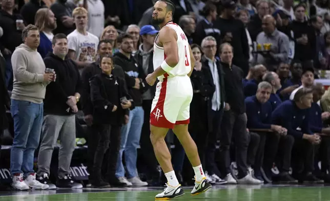 Houston Rockets forward Dillon Brooks (9) reacts after making a 3-point shot during the first half of an Emirates NBA cup basketball game against the Minnesota Timberwolves, Tuesday, Nov. 26, 2024, in Minneapolis. (AP Photo/Abbie Parr)