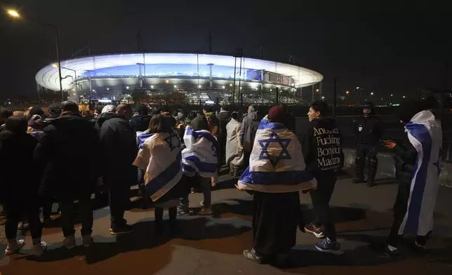 Israeli supporters arrive at the Stade de France stadium ahead of the Nations League soccer match France against Israel , Thursday, Nov. 14, 2024 in Saint-Denis, outside Paris. (AP Photo/Aurelien Morissard)