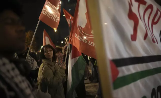 Demonstrators attend a rally in support of the Palestinian people, ahead of the Nations League soccer match France against Israel, Thursday, Nov. 14, 2024 in Saint-Denis, outside Paris. (AP Photo/Christophe Ena)