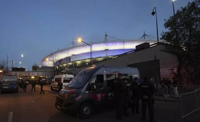 Police officers patrol in front of the stadium ahead of the Nations League soccer match France against Israel outside the Stade de France stadium, Thursday, Nov. 14, 2024 in Saint-Denis, outside Paris. (AP Photo/Aurelien Morissard)