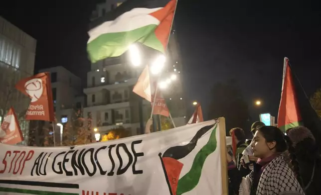 Demonstrators attend a rally in support of the Palestinian people, ahead of the Nations League soccer match France against Israel, Thursday, Nov. 14, 2024 in Saint-Denis, outside Paris. (AP Photo/Christophe Ena)