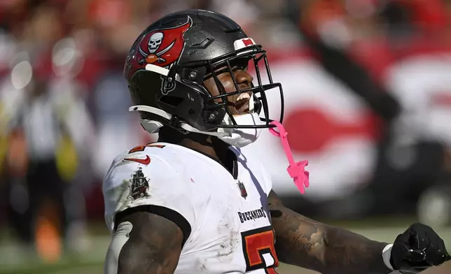 Tampa Bay Buccaneers running back Bucky Irving celebrates after scoring a touchdown against the San Francisco 49ers during the second half of an NFL football game in Tampa, Fla., Sunday, Nov. 10, 2024. (AP Photo/Jason Behnken)