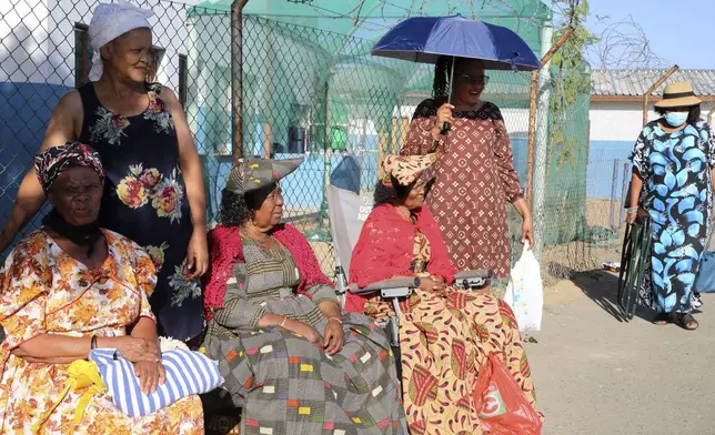 Namibians queue to cast their votes in a presidential election in Windhoek, Namibia Wednesday, Nov. 27, 2024. (AP Photo/Dirk Heinrich)