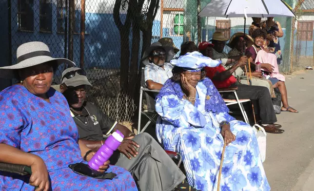 Namibians queue to cast their votes in presidential elections in Windhoek, Namibia Wednesday, Nov. 27, 2024. (AP Photo/Dirk Heinrich)