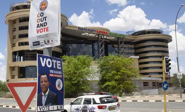 Elections poster of poles in Windhoek, Namibia, Sunday, Nov. 24, 2024 ahead of elections Wednesday, Nov. 27, 2024. (AP Photo/Esther Mbathera)