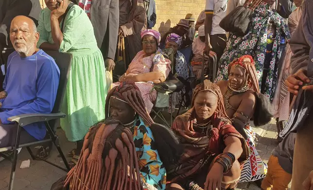 Namibians queue to cast their votes in a presidential election in Windhoek, Namibia Wednesday, Nov. 27, 2024. (AP Photo/Dirk Heinrich)