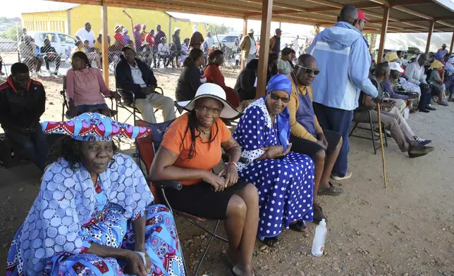 Namibians queue to cast their votes in a presidential election in Windhoek, Namibia Wednesday, Nov. 27, 2024. (AP Photo/Dirk Heinrich)