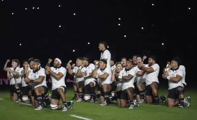 The All Blacks perform a haka ahead of the Autumn Nations series rugby union match between France and New Zealand at the Stade de France stadium, in Saint-Denis, outside Paris, Saturday, Nov. 16, 2024. (AP Photo/Michel Euler)