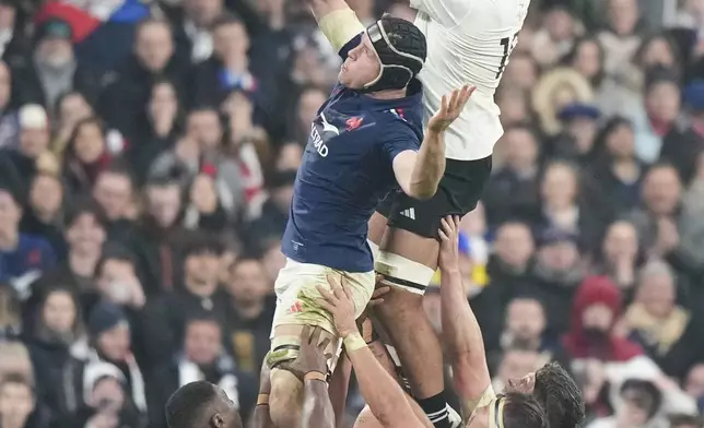 New Zealand's Patrick Tuipulotu, right, and France's Thibaud Flament compete for line out ball during the Autumn Nations series rugby union match between France and All Blacks at the Stade de France stadium, in Saint-Denis, outside Paris, Saturday, Nov. 16, 2024. (AP Photo/Michel Euler)