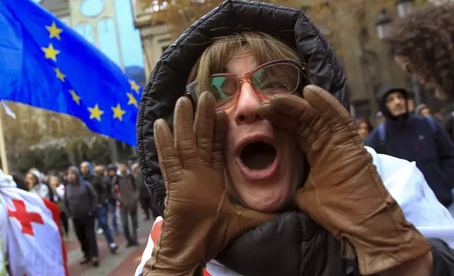 A protester shouts during a rally demanding new parliamentary elections in Tbilisi, Georgia, Monday, Nov. 25, 2024. (AP Photo/Shakh Aivazov)