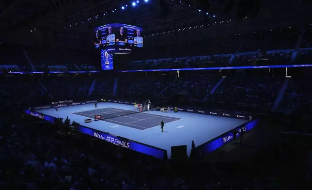 United States' Taylor Fritz, right, and Australia's Alex de Minaur during their singles tennis match of the ATP World Tour Finals at the Inalpi Arena, in Turin, Italy, Thursday, Nov. 14, 2024. (AP Photo/Antonio Calanni)