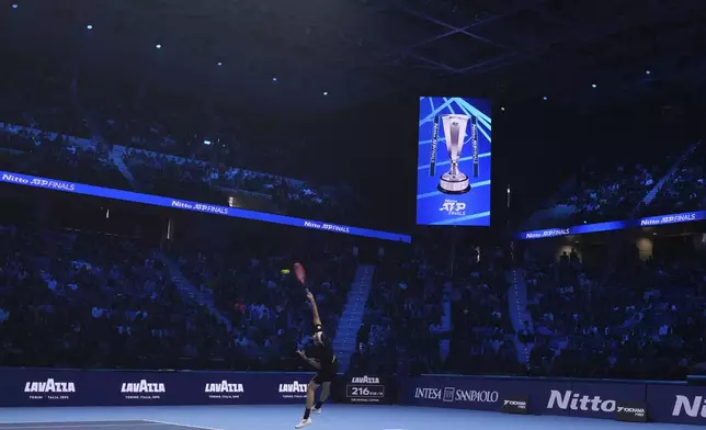 United States' Taylor Fritz serves the ball to Australia's Alex de Minaur during their singles tennis match of the ATP World Tour Finals at the Inalpi Arena, in Turin, Italy, Thursday, Nov. 14, 2024. (AP Photo/Antonio Calanni)