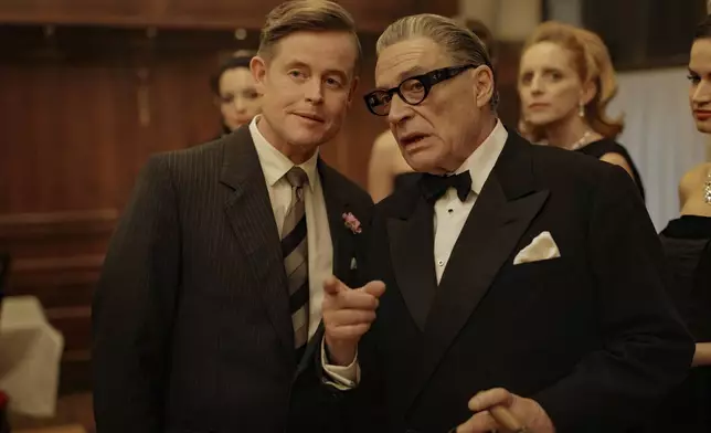 This image released by Netflix shows Caspar Phillipson, as JFK, left, and Haluk Bilginer, as Aristotle Onassis, in a scene from "Maria." (Pablo Larraín/Netflix via AP)