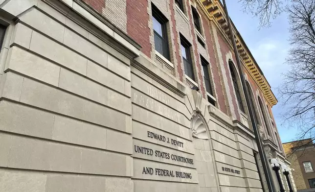 The Edward J. Devitt U.S. Courthouse and Federal building is seen, where two men on trial face human smuggling charges, Monday, Nov. 18, 2024, in Fergus Falls, Minn. (AP Photo/Michael Goldberg)