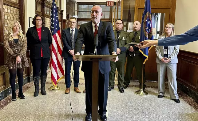 Minnesota U.S. Attorney Andy Luger addresses reporters on Friday, Nov. 22, 2024, at the federal courthouse in Fergus Falls, Minn., after two men were found guilty of human smuggling charges in connection with a case that led to the deaths of a family of four from India, who tried to cross the Canada-U.S. border during a blizzard in 2022. (AP Photo/Mark Vancleave)