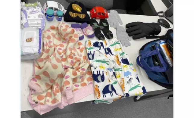 In an undated image released by the U.S. Attorney’s Office, shows items found in a migrant child’s backpack. (U.S. Attorney's Office via AP)