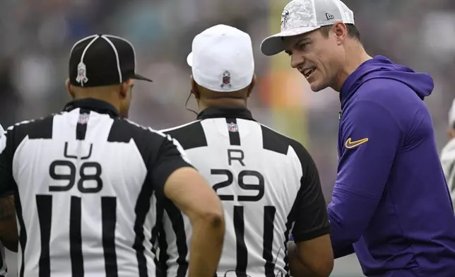 Minnesota Vikings head coach Kevin O'Connell talks with officials during the second half of an NFL football game against the Jacksonville Jaguars, Sunday, Nov. 10, 2024, in Jacksonville, Fla. (AP Photo/Phelan M. Ebenhack)