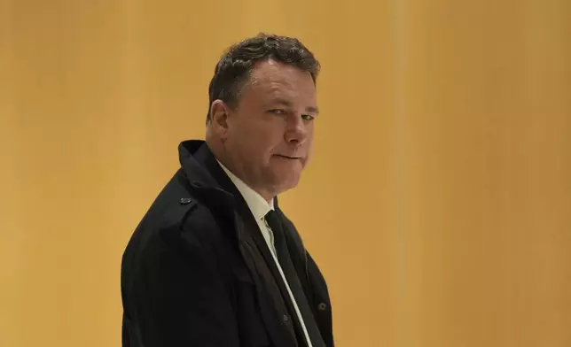 Far-right National Rally member and former Europarliament member Jean-Lin Lacapelle arrives at the courtroom for the last day of the trial on charges of embezzling European Parliament funds, Wednesday, Nov. 27, 2024 in Paris. (AP Photo/Aurelien Morissard)