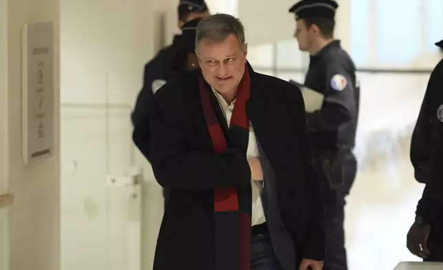 Louis Aliot, a member of the far-right National Rally party, arrives at the courtroom for the last day of the trial on charges of embezzling European Parliament funds, Wednesday, Nov. 27, 2024 in Paris. (AP Photo/Aurelien Morissard)