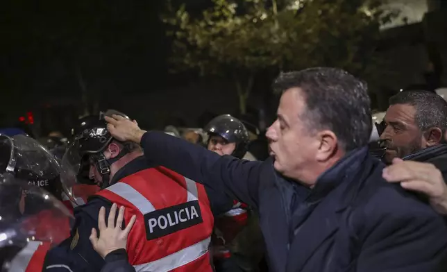 Supporters of the Albanian opposition clash with riot police in Tirana, Albania , Tuesday, Nov. 26, 2024 during an anti-government protest over the arrests of their leader Sali Berisha and former President Ilir Meta in separate corruption cases, saying the charges are politically motivated. (AP Photo/Vlasov Sulaj)