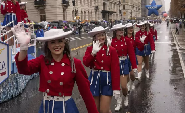 Parade performers march down Central Park West during the Macy's Thanksgiving Day parade, Thursday, Nov. 28 2024, in New York. (AP Photo/Yuki Iwamura)