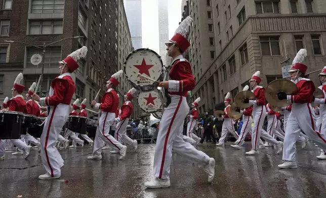 The Macy's Great American Marching Band plays as it heads down Sixth Avenue during the Macy's Thanksgiving Day Parade, Thursday, Nov. 28, 2024, in New York. (AP Photo/Julia Demaree Nikhinson)