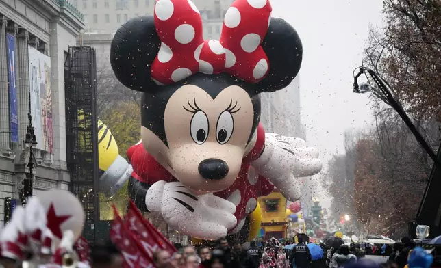 The Minnie Mouse balloon floats in the Macy's Thanksgiving Day Parade on Thursday, Nov. 28, 2024, in New York. (Photo by Charles Sykes/Invision/AP)