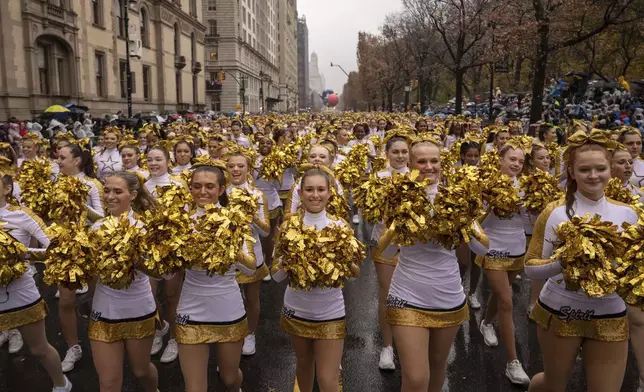 Parade performers march down Central Park West during the Macy's Thanksgiving Day parade, Thursday, Nov. 28 2024, in New York. (AP Photo/Yuki Iwamura)