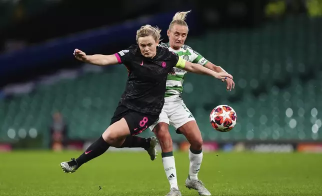 Chelsea's Erin Cuthbert, left and Celtic's Natalie Ross vie for the ball, during the Women's Champions League, group B soccer match between Celtic Women and Chelsea Women, at Celtic Park, Glasgow, Scotland, Wednesday Nov. 13, 2024. (Andrew Milligan/PA via AP)