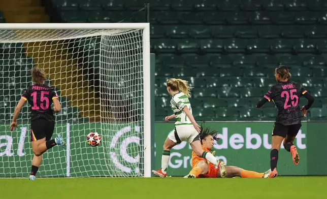 Celtic's Murphy Agnew, center, scores her side's first goal of the game, during the Women's Champions League, group B soccer match between Celtic Women and Chelsea Women, at Celtic Park, Glasgow, Scotland, Wednesday Nov. 13, 2024. (Andrew Milligan/PA via AP)