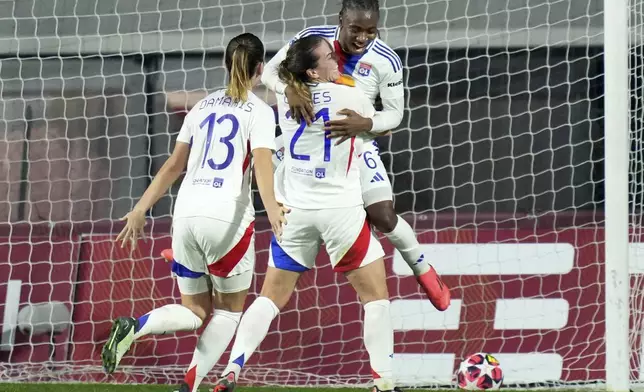 Olympique Lyonnais' Melchie Dumornay, top, celebrates after scoring the opening goal during the women's Champions League soccer match between AS Roma and Olympique Lyon in Rome, Italy, Wednesday, Nov. 13, 2024 (Photo by Alfredo Falcone/LaPresse via AP)