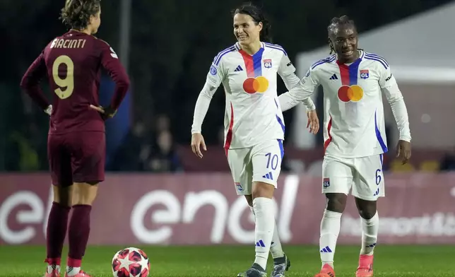 Olympique Lyonnais' Melchie Dumornay, right, celebrates after scoring her side's second goal during the women's Champions League soccer match between AS Roma and Olympique Lyon in Rome, Italy, Wednesday, Nov. 13, 2024 (Photo by Alfredo Falcone/LaPresse via AP)