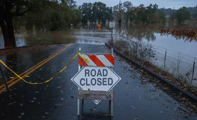 Wohler Road off River Road is closed off as the Russian River floods in Sonoma County, Calif., on Friday, Nov. 22, 2024. (Santiago Mejia/San Francisco Chronicle via AP)