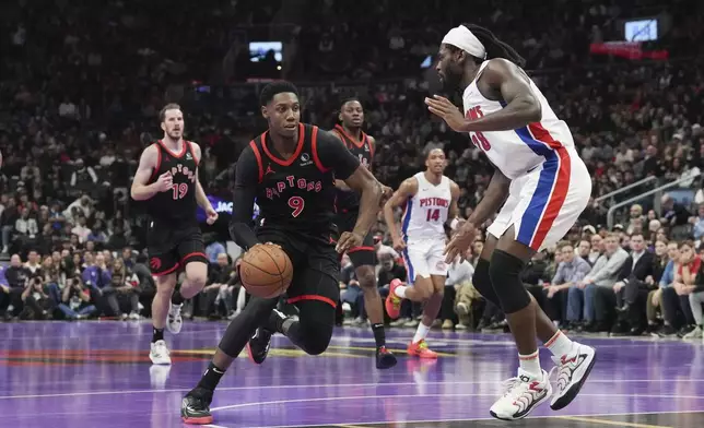 Toronto Raptors' RJ Barrett tries to get past Detroit Pistons' Isaiah Stewart during the first half of an Emirates NBA Cup basketball game, Friday, Nov. 15, 2024 in Toronto. (Chris Young/The Canadian Press via AP)