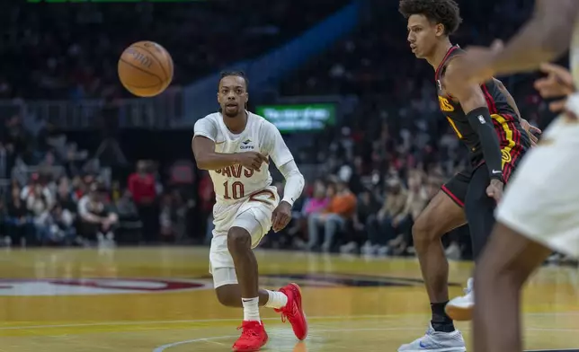 Cleveland Cavaliers guard Darius Garland (10) passes the ball against the Atlanta Hawks during the first half of an Emirates NBA Cup basketball game Friday, Nov. 29, 2024, in Atlanta. (AP Photo/Erik Rank)