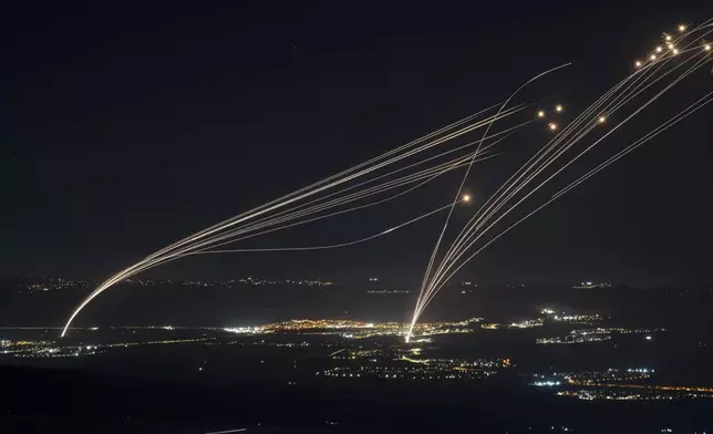 The Israeli Iron Dome air defense system fires to intercept an attack from Lebanon over the Galilee region as seen from the Israeli-annexed Golan Heights, on Aug. 4, 2024. (AP Photo/Leo Correa)