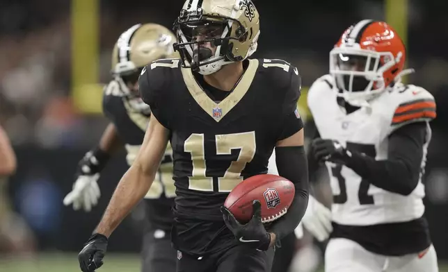 New Orleans Saints wide receiver Dante Pettis (17) carries on a long punt return in the second half of an NFL football game against the Cleveland Browns in New Orleans, Sunday, Nov. 17, 2024. (AP Photo/Gerald Herbert)