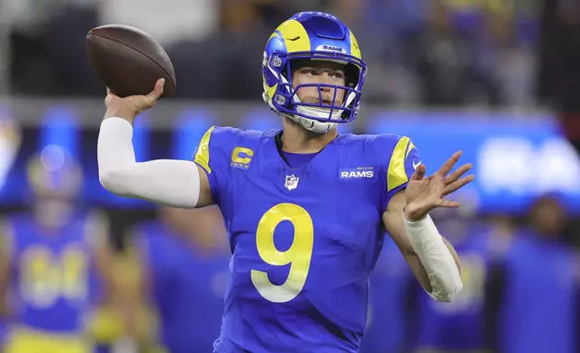 Los Angeles Rams quarterback Matthew Stafford (9) passes against the Philadelphia Eagles during the first half of an NFL football game in Inglewood, Calif., Sunday, Nov. 24, 2024. (AP Photo/Ryan Sun)