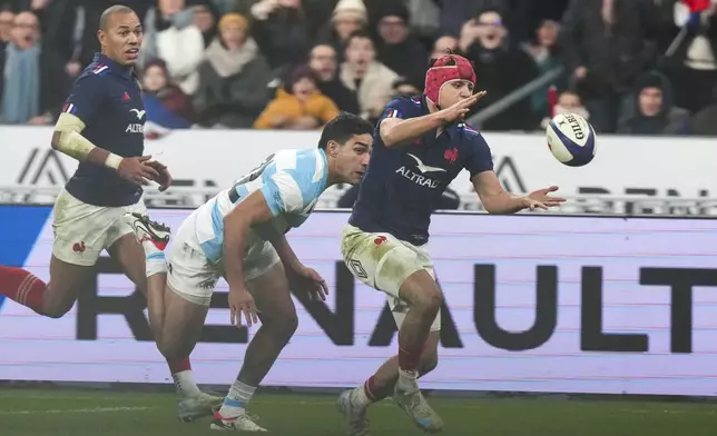 France's Louis Bielle-Biarrey reaches for the ball to score a try during the Autumn Nations Series rugby international between France and Argentina at the Stade de France stadium at Saint-Denis on the outskirts of Paris, Friday, Nov. 22, 2024. (AP Photo/Thibault Camus)