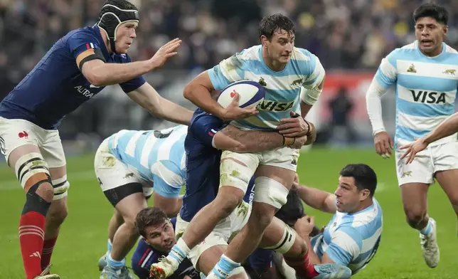 Argentina's Juan Martin Gonzalez runs at the defence during the Autumn Nations Series rugby international between France and Argentina at the Stade de France stadium at Saint-Denis on the outskirts of Paris, Friday, Nov. 22, 2024. (AP Photo/Thibault Camus)